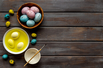 Colored Easter eggs with yellow dye. Top view