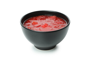 Bowl of beetroot soup isolated on white background