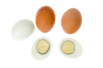 Boiled chicken eggs with colored shells on white background.