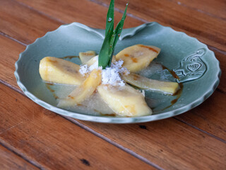 A decorative plate of plantains including leaves, sugar, and more.  Native to Indonesia.