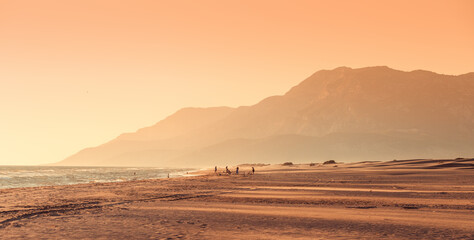 Sunset view of the Mediterranean coast near Patara beach in Turkey. High mesmerizing mountains in...