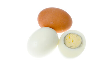 Boiled chicken eggs with colored shells on white background.