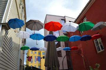 Hanging colorful umbrellas adorn the street in Bergen, Norway