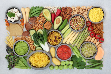 Vegan health food for a plant based diet with a large collection of food high in antioxidants, protein, minerals, fibre, anthocyanins, vitamins, lycopene, omega 3  smart carbs. Healthy eating concept.