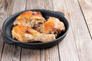 Baked chicken in a pan, homemade food