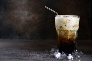 Iced coffee or frappe with mint  in a tall glass.