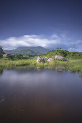 Fototapeta na wymiar Ranu Manduro of Indonesia with Penanggungan Mountain Reflection. Early Morning