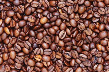 Background of roasted coffee beans. The texture of the coffee.