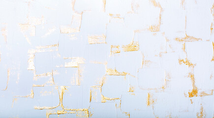 White and gold textured decorative plaster surface
