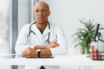 African American man male hospital doctor in white coat with stethoscope