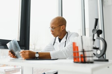 Naklejka na ściany i meble african american doctor in modern office