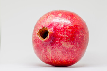 Fresh red and ripe pomegranates, isolated in white
