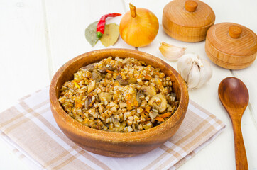 Boiled buckwheat porridge with stewed mushrooms and vegetables.