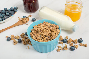 granola with blueberries and milk