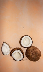 Fototapeta na wymiar Half of coconuts isolated on color background. Coconut cream. Top View. Flat lay.