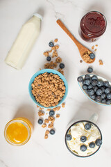 granola with blueberries and milk