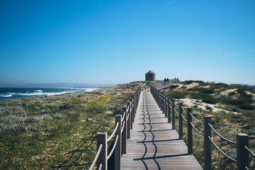 Fototapeta premium wooden path along sea in portugal
