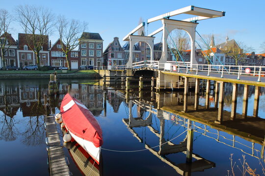 The historic city center of Weesp, a small town located in the East of Amsterdam, North Holland, Netherlands, with reflections of the drawbridge Lange Vechtbrug on the Vecht canal