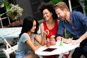 Group of friends having fun together. People talking laughing and enjoying their time