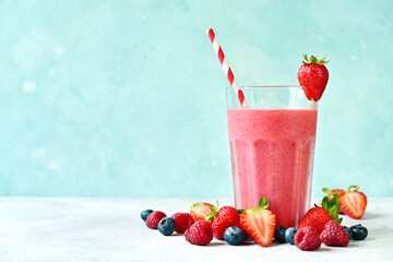 Fresh cold strawberry berry smoothie in a tall glass. © lilechka75