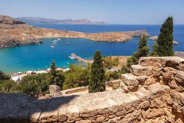 Beautiful view of the bay and the sea from the ancient ruins of the city of Lindos on the island of...