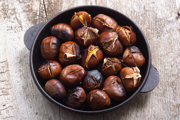 Tasty fried chestnut snack background