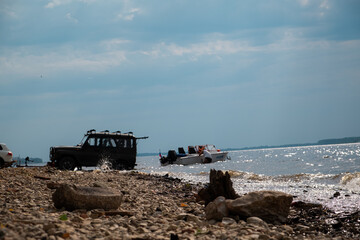 Fototapeta na wymiar car and boat on the Russian river