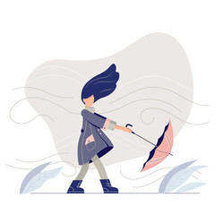 A stylish girl walking in a windy day. Young woman in a trendy coat with umbrella. 