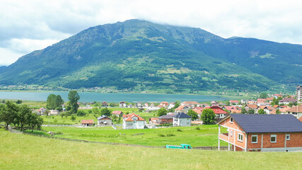 Fototapeta na wymiar Mountain village at lake in Montenegro
