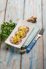octopus carpaccio with potatoes parsley and ginger