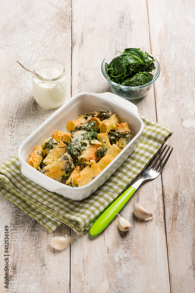 Wall mural oven pasta with spinach and cream sauce