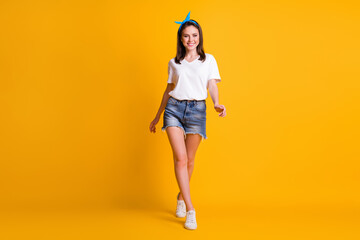 Fototapeta na wymiar Full size photo of fit lovely young woman walk summer weekend isolated on bright color background