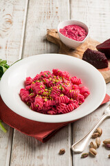 pasta with beet pesto and pistachio nuts