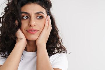 Fototapeta premium Pleased beautiful brunette girl posing and looking aside