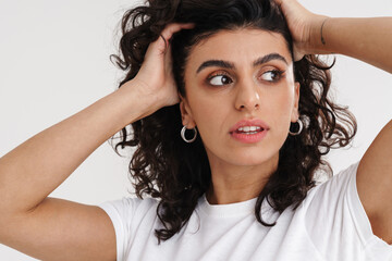 Thinking beautiful brunette girl posing and looking aside