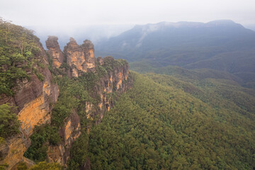 Fototapeta na wymiar Classic landscape view of the Three Sisters rock formation near Katoomba above the Jamison Valley in the Blue Mountains National Park in NSW, Australia.