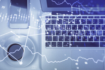 Stock market chart and top view computer on the table background. Multi exposure. Concept of financial analysis.