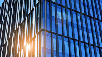 Downtown corporate business district architecture. Glass reflective office buildings against blue sky and sun light. Economy, finances, business activity concept.