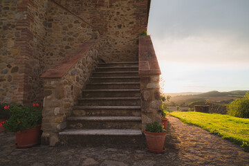 Steps up to a rustic stone countryside farmhouse near Radicondoli in the province of Siena in...