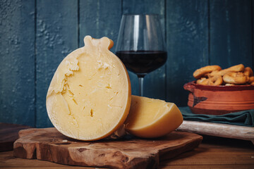 Delicious Caciocavallo cheese on a wooden board