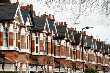 Street of British terraced houses with bay windows