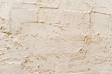 Decorative white plaster is on the wall