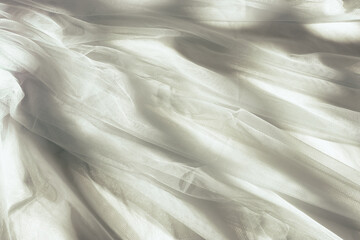 Vintage white tulle chiffon texture background with shadows