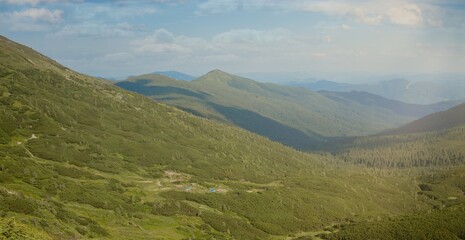 Naklejka premium Carpathians mountain range at summer morning. Beauty of wild virgin Ukrainian nature. Peacefulness.
