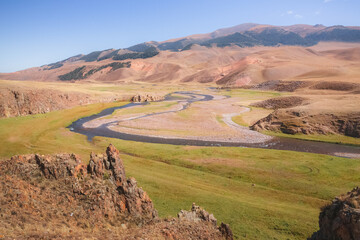 Sweeping vista landscape of the Assy Plateau, a large mountain steppe valley and summer pasture 100km from Almaty, Kazakhstan.