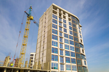 Fototapeta na wymiar High residential apartment building under construction. Real estate development.