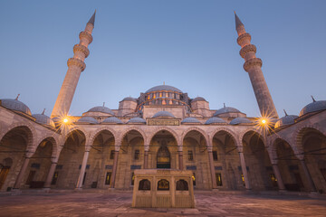 Fototapeta na wymiar Night view of the 16th century Ottoman courtyard at Suleymaniye Mosque, designed by Sinan for Suleiman the Magnificent in Istanbul, Turkey.