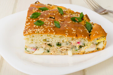 Homemade pie with boiled egg and green onions