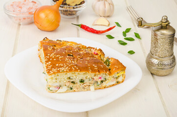 Homemade pie with boiled egg and green onions