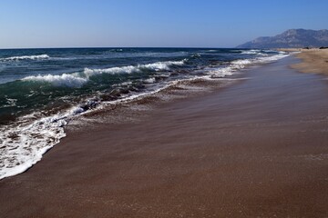 A wave on the shore of a sandy seashore. Patara Beach